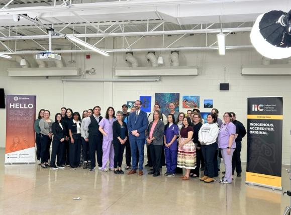 minister surrounded by SNP staff and students