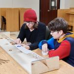 STEAM students working on wampum belt