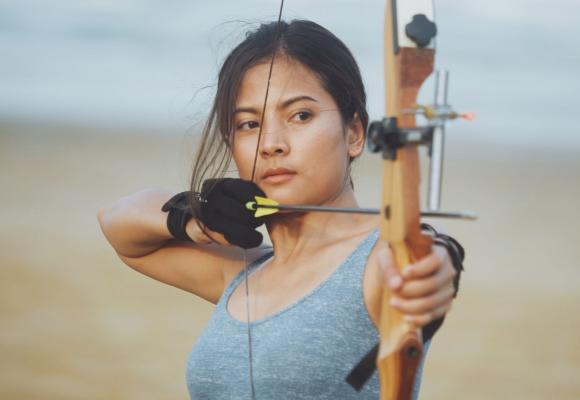 woman drawing a bow