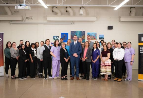 Ontario minister with staff and students