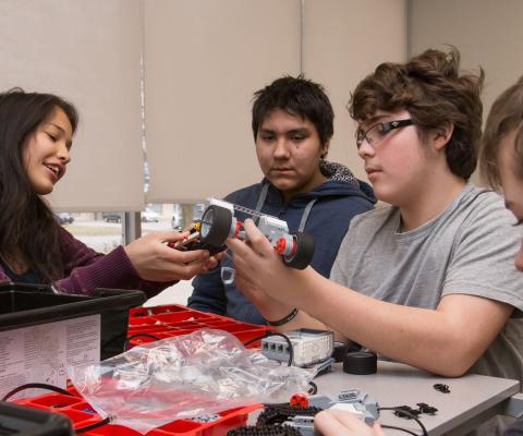 students playing with robot