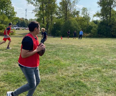 students playing football