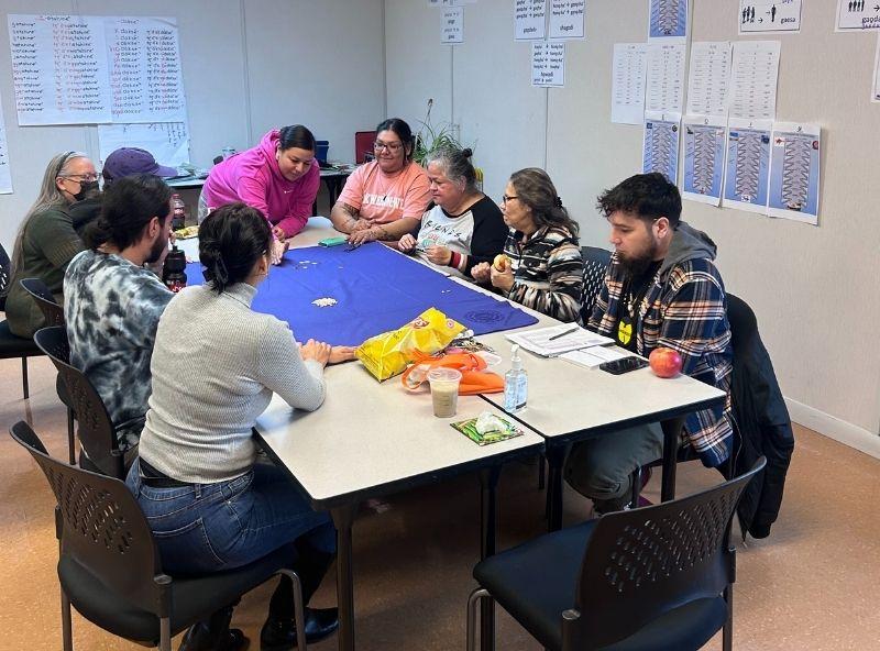 people sitting around table playing games