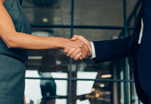 man and woman shaking hands
