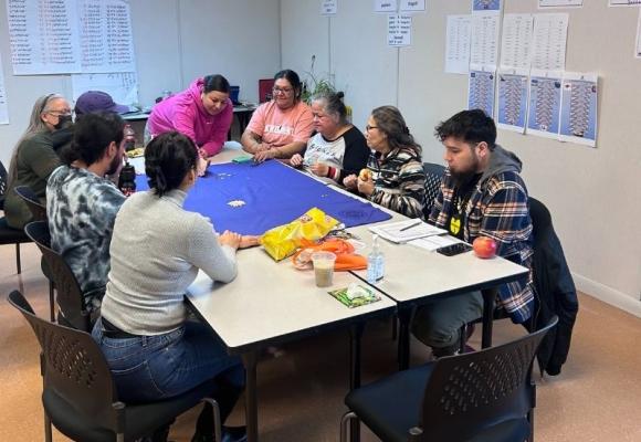 people sitting around table playing games